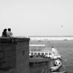 A couple enjoys a scenic view over the Ganges River in Varanasi, India.